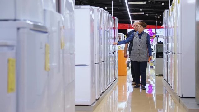 Couple Shopping In Supermarket Of Home Appliances