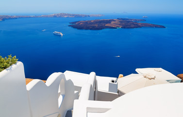 Greece, Santorini island, caldera view with cruise ship on sea. View from white roofs and steps.