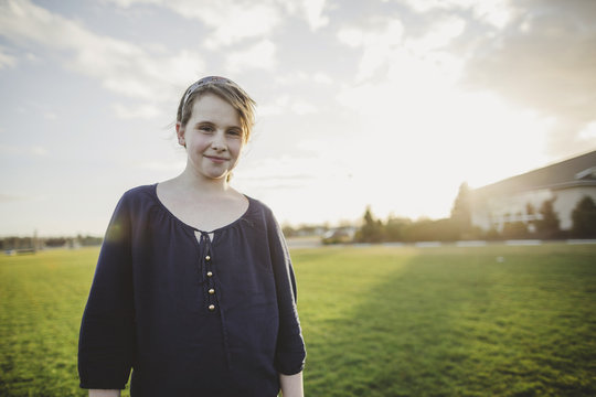 Cute Middle School Aged Caucasian Girl Happy In Windy Field 