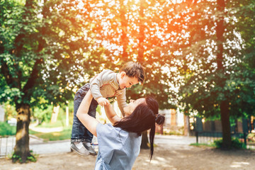 Fototapeta premium Mother with her little son outdoor in the park