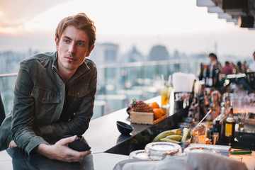 Man waiting for his drink at the bar