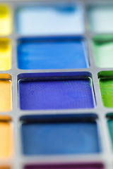 pallet of colored eye shadows, texture. Shallow depth of field