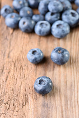 Blueberries large on an old wooden background. Fresh blueberries. Blueberry