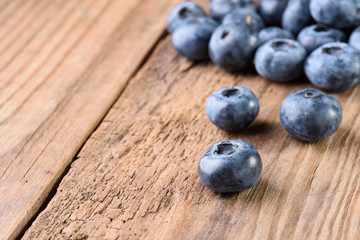 Blueberries large on an old wooden background with copy space. Fresh blueberries. Blueberry