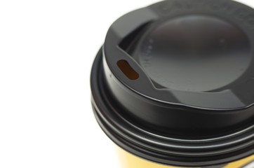 Fototapeta premium Brown coffee cup with lids black with openings for lifting drinking isolated on white background. Package. 