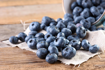 Fresh blueberry close-up on an old wooden background. Fresh blueberries. Blueberry