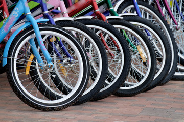 The front wheels of the bikes in the Parking lot