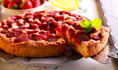 Strawberry cake, sliced and served