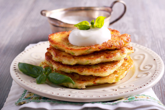 Zucchini and feta fritters with sour cream