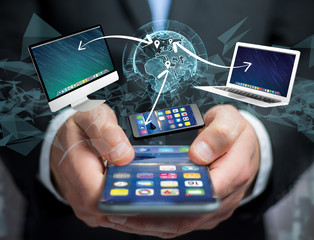 Computer and devices displayed on a futuristic interface with interantional network - Multimedia and technology concept