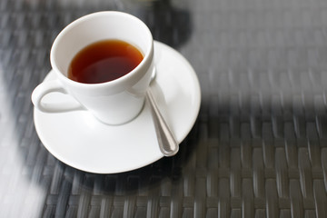 Closeup of cup of tea on vintage wooden background