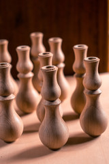 Wooden fragment ornament for shisha decoration on a wooden background.