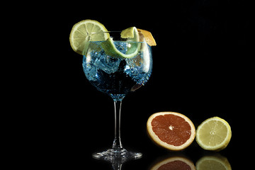 Fototapeta na wymiar Gin blue tonic with grapefruit and lemon