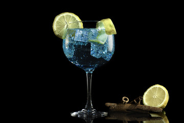 Gin blue tonic with lemon and cinnamon
