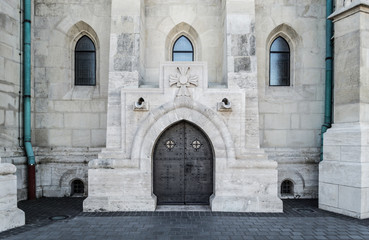 An ornate gothic black door on the Matthias Church in Budapest, Hungary