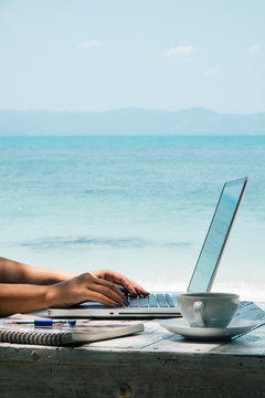 Woman Working by the Sea