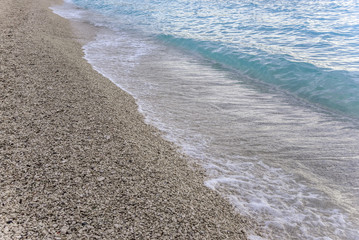 Sea surf on a stony beach.