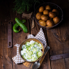 fresh cucumber salad with yogurt and young potatoes