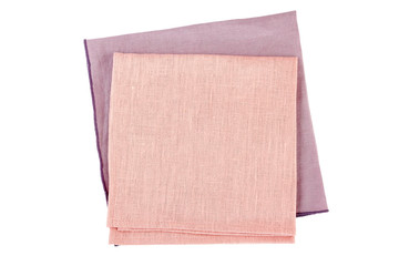 Folded purple and pink textile napkins on white