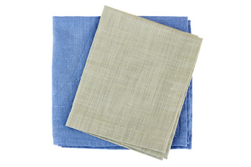 Two folded textile napkins on white