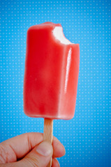 red ice cream in the form of ice lolly