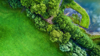 Drone flight in the summer above the are of Aachen with its flields, forest and meadows