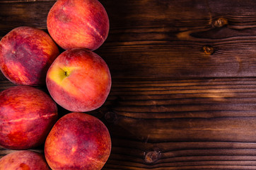 Fresh ripe peaches on wooden table. Top view