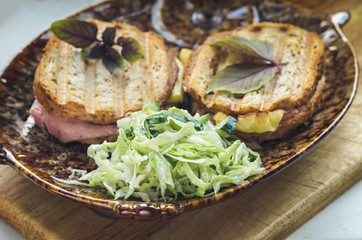 Breakfast of sandwiches and vegetable salad