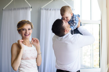 Happy family. Father, mother and child son having fun together