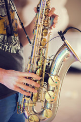 A man with saxophone in hands