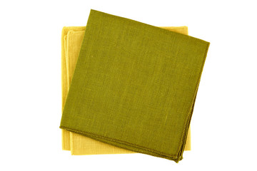 Green and yellow textile napkins on white
