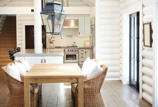 Dining room and kitchen in modern design log cabin home