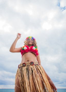 Hawaiian beautiful woman portrait dancing on the beach