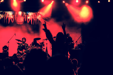 crowd with raised hands at concert - summer music festival