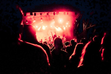 Naklejka na ściany i meble crowd with raised hands at concert - summer music festival