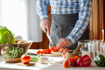 male cooking healthy salad