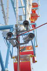 Several video cameras are monitoring the public order in the amusement park