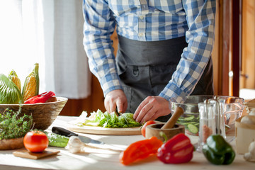 male cooking healthy salad