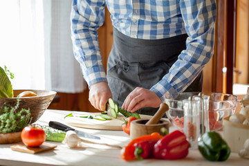 male cooking healthy salad