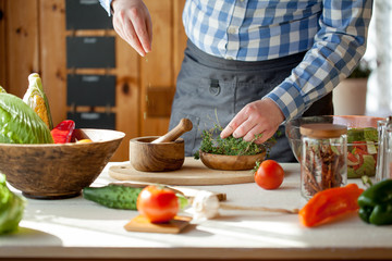 male cooking healthy salad