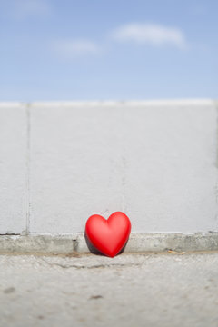 Red heart against a wall
