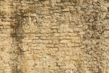 Pattern of the ancient style stone wall with cement.