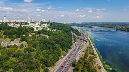 Fototapeta premium Aerial top view of Kiev Pechersk Lavra churches on hills from above, Kyiv city, Ukraine 
