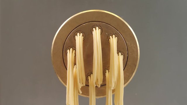 Automated food factory make fresh pasta, chef in modern restaurant prepare pasta, spaghetti tagliatelle