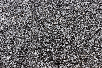Black background - rubble covered with bitumen