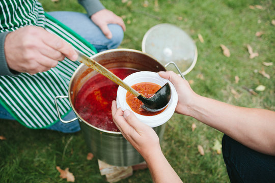 Serving goulash lunch outdoors