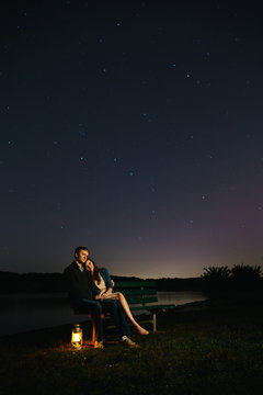young couple under the stars at night