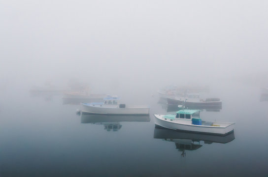 lobster fishing boats shrouded in mist