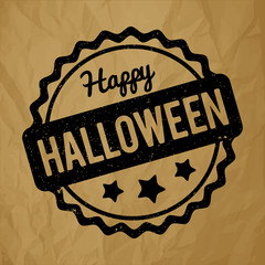 Happy Halloween rubber stamp black on a crumpled paper brown background.