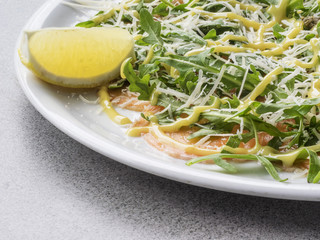 Salmon carpaccio with feta pieces
